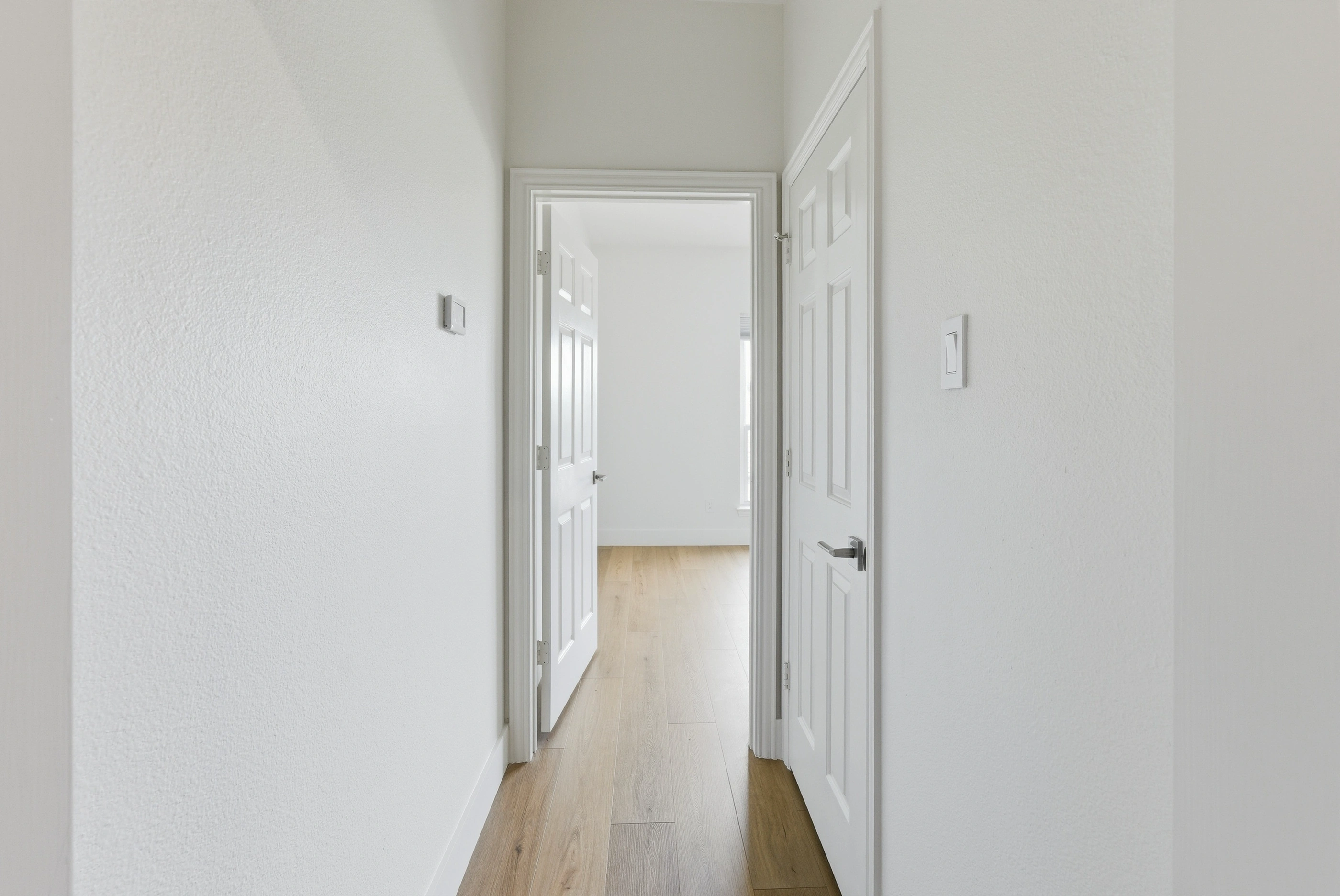 Upstairs hallway with bedroom doors
